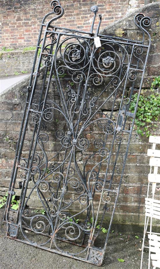 A pair of black painted wrought iron gates